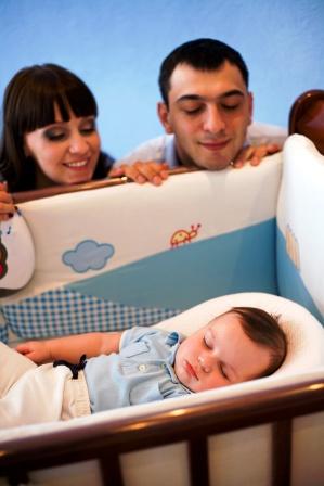 child sleeping parents watching