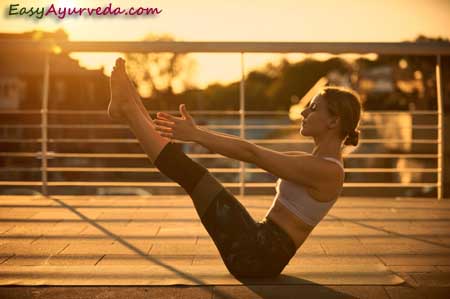 young blond hair woman in yoga pose Paripurna Navasana or Full boat Pose  isolated on white background Stock Photo - Alamy